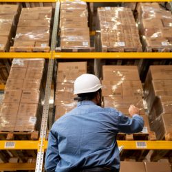 man-with-helmet-working-warehouse